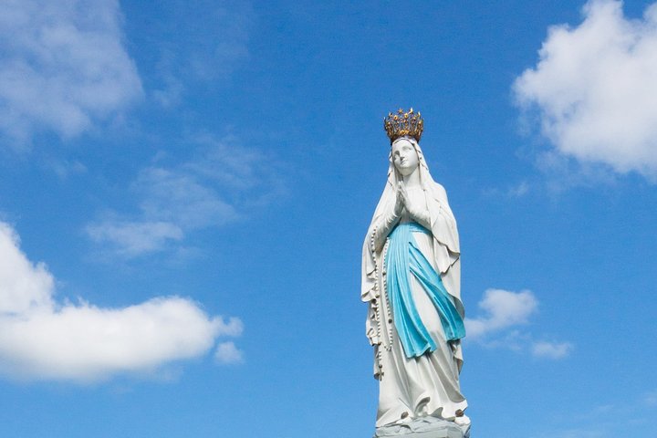 A guided walking tour of the Our Lady of Lourdes sanctuary is offered.